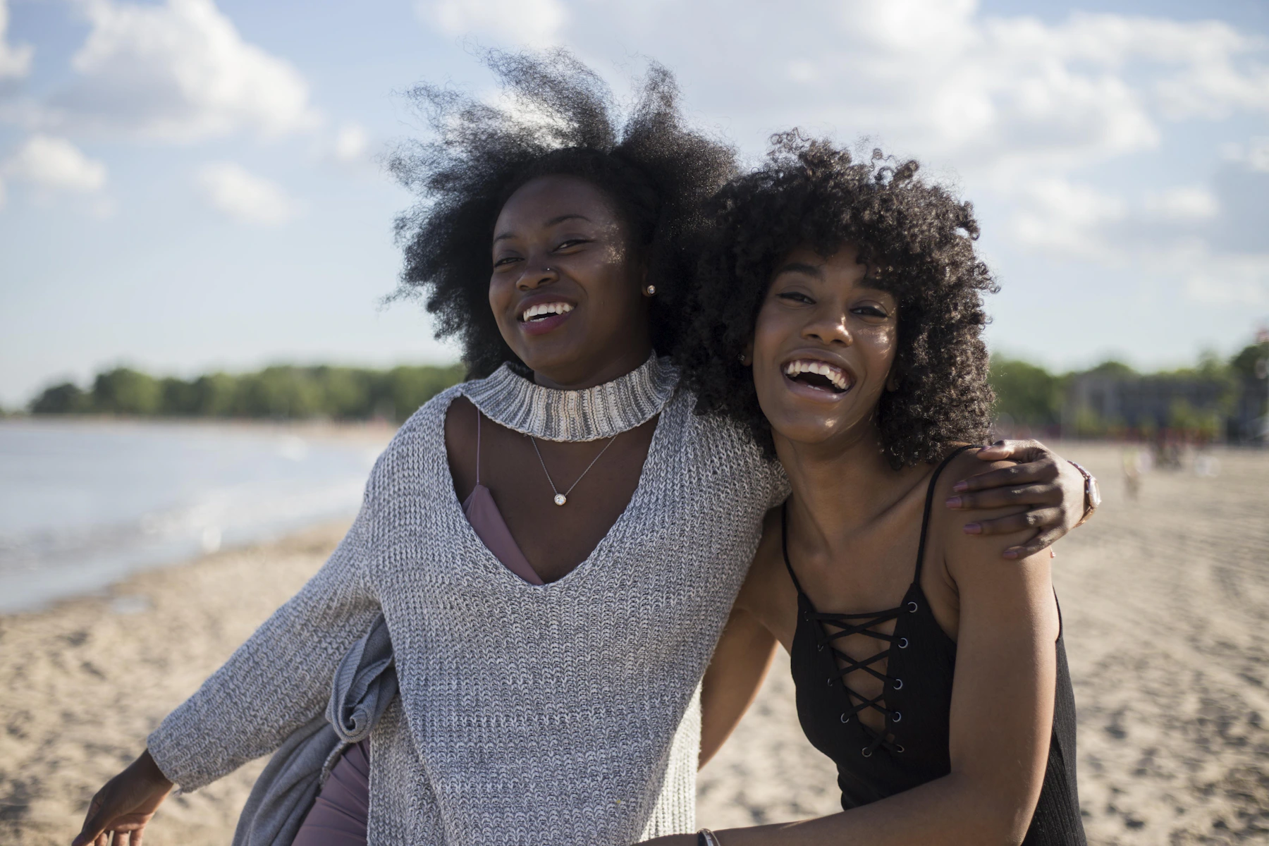Photo of woman beside another woman at seashore