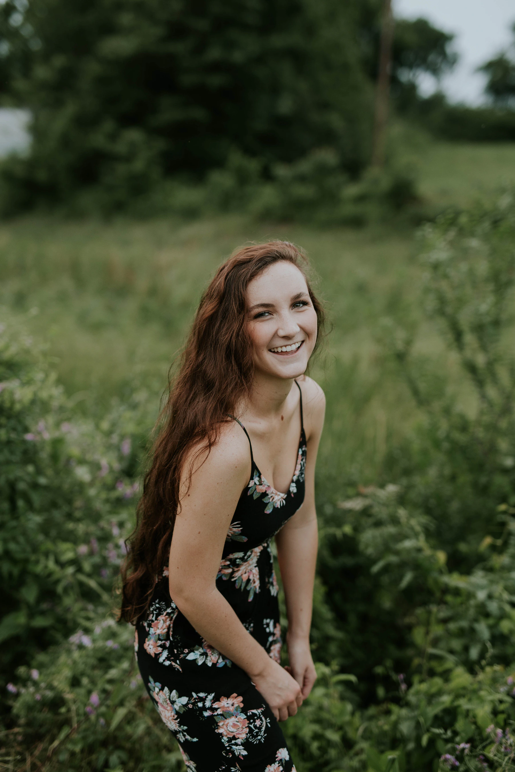 Laughing woman in floral dress