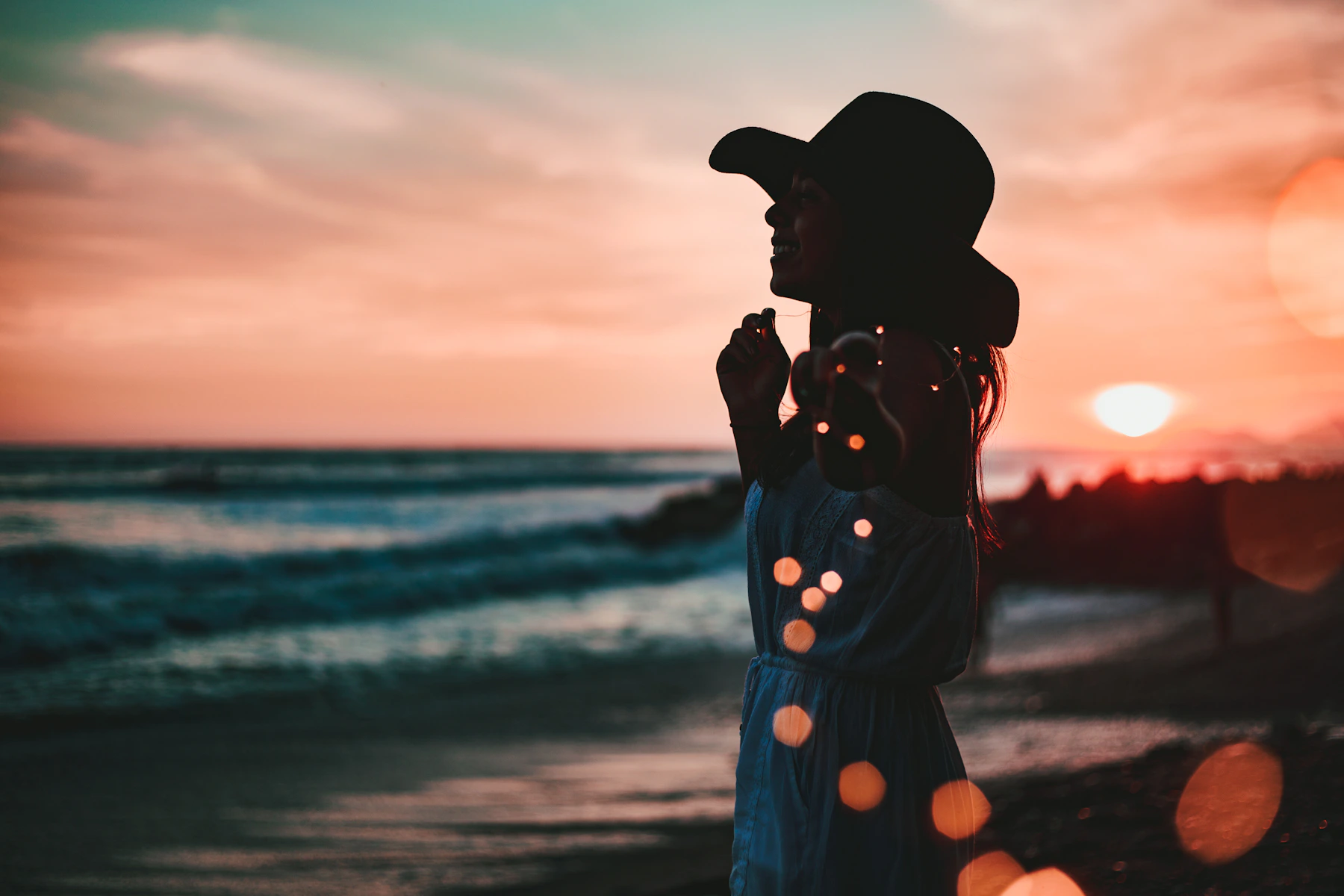 Woman in seashore during golden hour